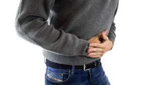 a man holding his stomach in pain