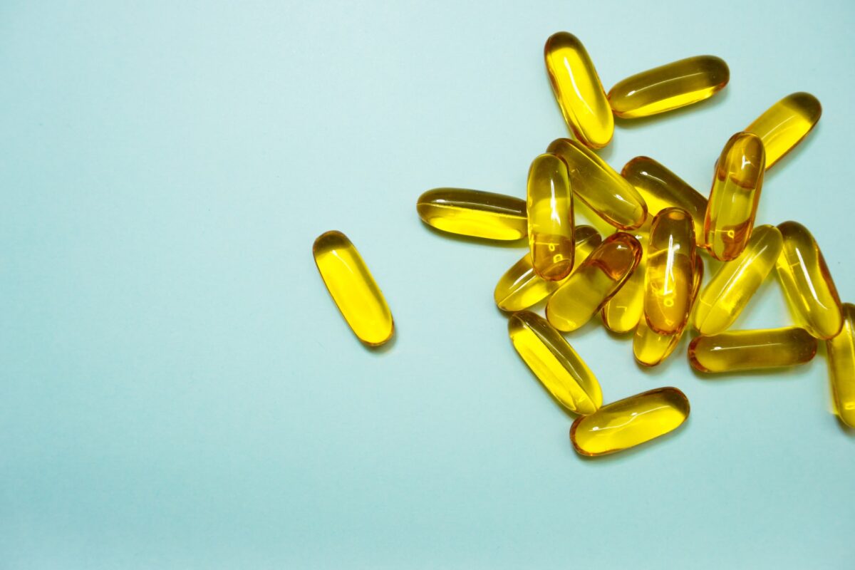 A pile of yellow vitamin D supplements