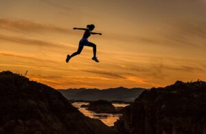 woman-leaping-in-sunset