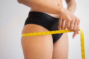 Person measuring their hips