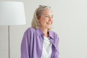 smiling woman after an anti-aging peptide therapy session