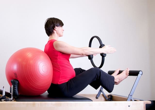 Woman exercising with fitness equipment