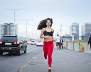 a woman running on the city streets