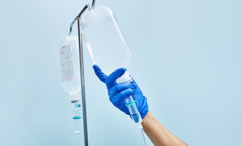 Person holding IV bag