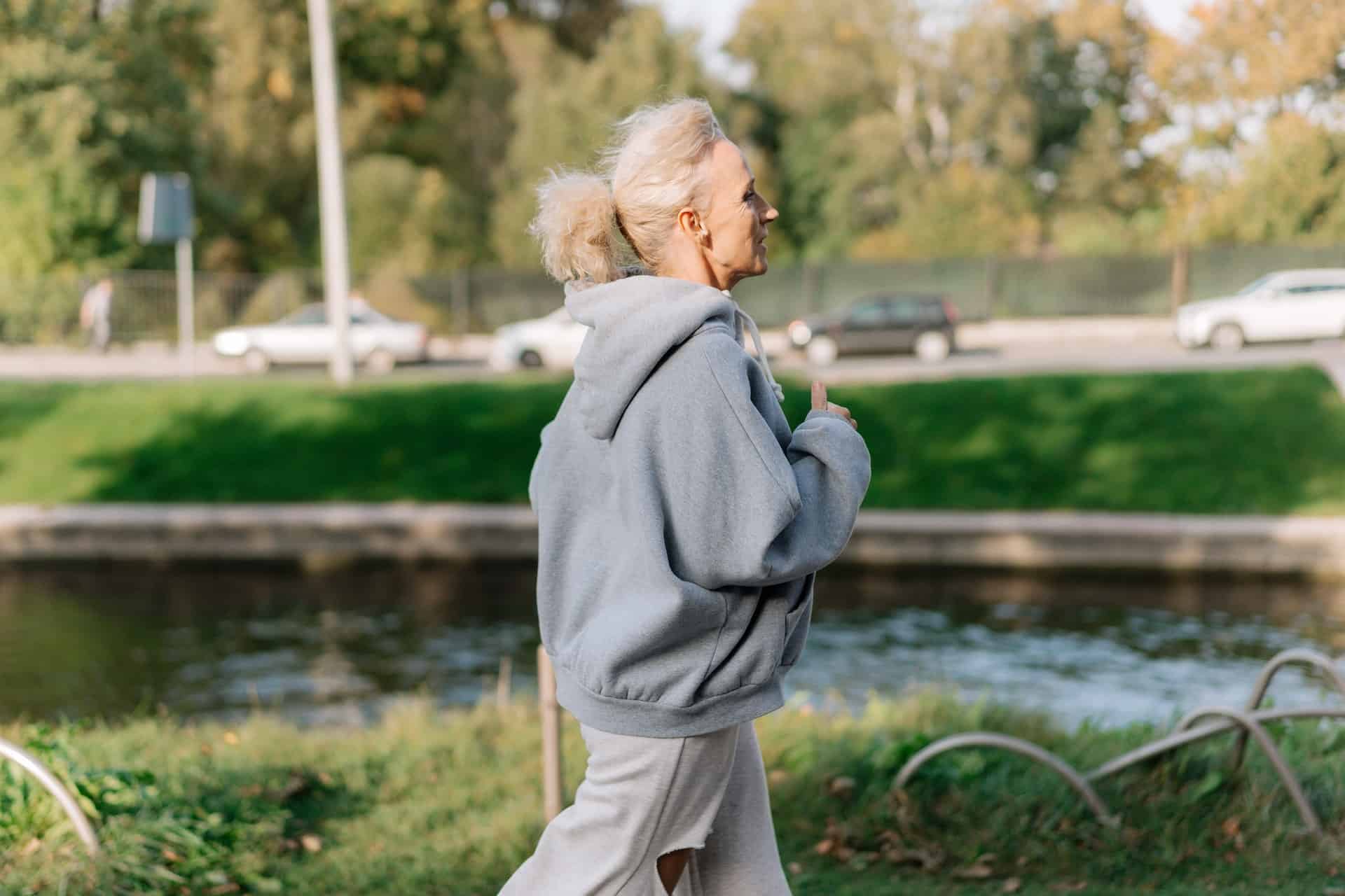 Older woman jogging in a park 