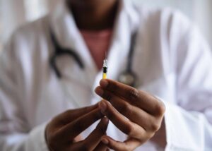 a doctor preparing a peptide injection