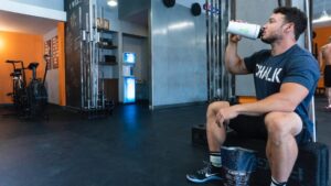 man drinking a protein shake