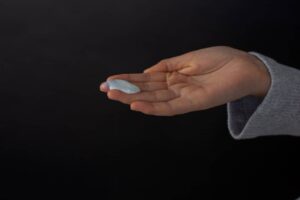 someone holding cream