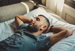 a man asleep on a bed