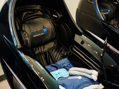 Zero-gravity massage chair with Prime IV blankets and socks for relaxation