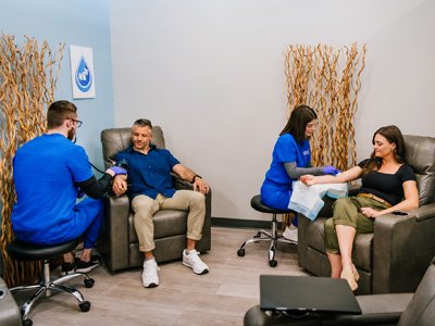 Couple getting IV therapy and vitamin injections together